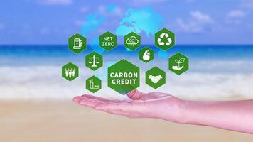 Green energy, Carbon credit market concept, Businessman holding Carbon credit icon, Net zero, Green energy icon. Carbon Neutral in industry Net zero emission eco energy. photo