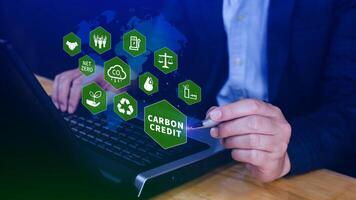 Green energy, Carbon credit market concept, Businessman pointing Carbon credit icon, Net zero, Green energy icon. Carbon Neutral in industry Net zero emission eco energy. photo