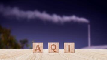 AQI, Abbreviation of air quality index word written on wooden blocks. text AQI on nature background, environment concept. photo