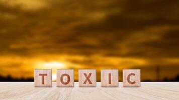 Toxic concept, Cubes wooden blocks form the word Toxic. extensive Toxic Concept applies to both relationships and the chemical industry. photo