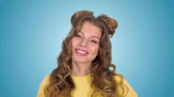 Portrait of a beautiful enthusiastic girl with long hair smiling while having a good mood. With green screen video