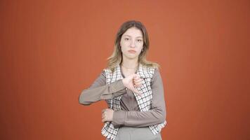 Young woman looking at camera with a negative expression. video