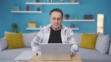 Man closing laptop with angry expression. video