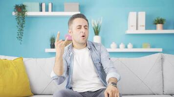 Man doing rocker sign and dancing. video