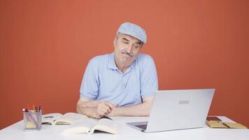 Man looking at laptop is thoughtful. video