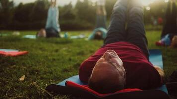 Group of senior person having fun sitting on mat after workout activity. video