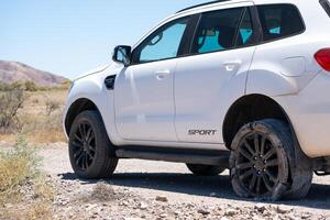 Outback Roadside Trouble Flat Tire on SUV photo