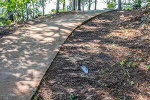 Plastic bottle laying on the ground photo