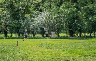 Man playing disc golf photo