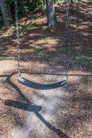Playground swing seat closeup photo