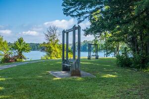 Bench swings at the lake photo