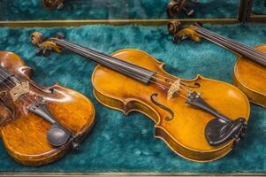 Antique violins closeup photo