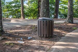 Garbage can overflow in the park photo