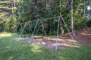 Old swing set in the park photo
