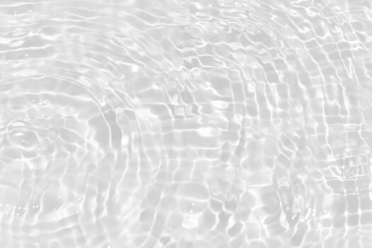 Bluewater waves on the surface ripples blurred. Defocus blurred transparent blue colored clear calm water surface texture with splash and bubbles. Water waves with shining pattern texture background. photo