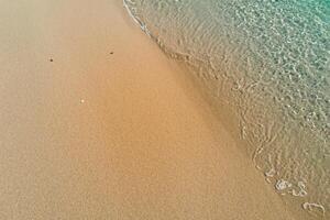 Horizon Haven Aerial Serenity Captures Beautiful Beach Sand from Above, a Tranquil Tapestry of Coastal Beauty photo