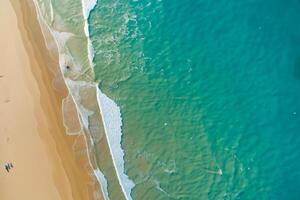 Horizon Haven Aerial Serenity Captures Beautiful Beach Sand from Above, a Tranquil Tapestry of Coastal Beauty photo