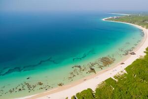 Horizon Haven Aerial Serenity Captures Beautiful Beach Sand from Above, a Tranquil Tapestry of Coastal Beauty photo