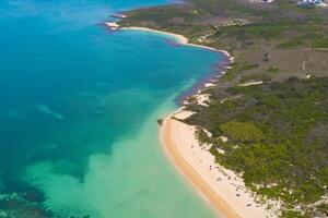 Horizon Haven Aerial Serenity Captures Beautiful Beach Sand from Above, a Tranquil Tapestry of Coastal Beauty photo