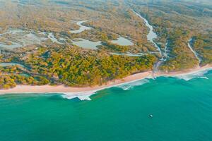 Horizon Haven Aerial Serenity Captures Beautiful Beach Sand from Above, a Tranquil Tapestry of Coastal Beauty photo