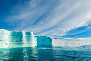 Majestic Ice Cliffs Crowned by a Cool Atmosphere, Framed by the Beautiful Sea and Sky, Conjuring a Harmonious Panorama of Nature's Icy Grandeur and Oceanic Splendor photo