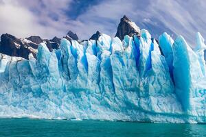 Majestic Ice Cliffs Crowned by a Cool Atmosphere, Framed by the Beautiful Sea and Sky, Conjuring a Harmonious Panorama of Nature's Icy Grandeur and Oceanic Splendor photo