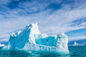 Majestic Ice Cliffs Crowned by a Cool Atmosphere, Framed by the Beautiful Sea and Sky, Conjuring a Harmonious Panorama of Nature's Icy Grandeur and Oceanic Splendor photo