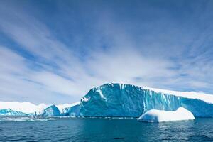 Majestic Ice Cliffs Crowned by a Cool Atmosphere, Framed by the Beautiful Sea and Sky, Conjuring a Harmonious Panorama of Nature's Icy Grandeur and Oceanic Splendor photo