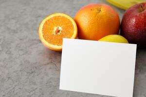 Card and White Paper Mockup Harmonized with Fresh Fruit, Crafting a Visual Symphony of Artful Design and Culinary Delight, Where Wholesome Ingredients Merge in a Feast of Vibrant Imagery photo