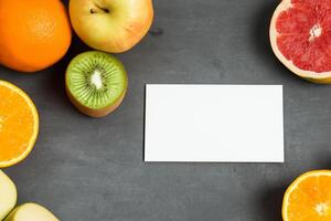 Card and White Paper Mockup Harmonized with Fresh Fruit, Crafting a Visual Symphony of Artful Design and Culinary Delight, Where Wholesome Ingredients Merge in a Feast of Vibrant Imagery photo