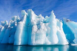 Majestic Ice Cliffs Crowned by a Cool Atmosphere, Framed by the Beautiful Sea and Sky, Conjuring a Harmonious Panorama of Nature's Icy Grandeur and Oceanic Splendor photo