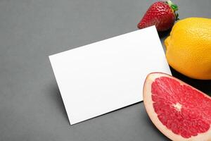 Card and White Paper Mockup Harmonized with Fresh Fruit, Crafting a Visual Symphony of Artful Design and Culinary Delight, Where Wholesome Ingredients Merge in a Feast of Vibrant Imagery photo