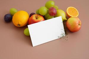 Card and White Paper Mockup Harmonized with Fresh Fruit, Crafting a Visual Symphony of Artful Design and Culinary Delight, Where Wholesome Ingredients Merge in a Feast of Vibrant Imagery photo
