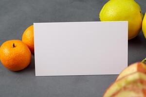 Card and White Paper Mockup Harmonized with Fresh Fruit, Crafting a Visual Symphony of Artful Design and Culinary Delight, Where Wholesome Ingredients Merge in a Feast of Vibrant Imagery photo