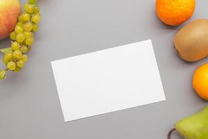 Card and White Paper Mockup Harmonized with Fresh Fruit, Crafting a Visual Symphony of Artful Design and Culinary Delight, Where Wholesome Ingredients Merge in a Feast of Vibrant Imagery photo