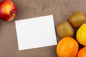 Card and White Paper Mockup Harmonized with Fresh Fruit, Crafting a Visual Symphony of Artful Design and Culinary Delight, Where Wholesome Ingredients Merge in a Feast of Vibrant Imagery photo