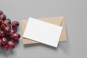 White Paper Mockup Enhanced by the Juicy Allure of Fresh Grapes, Crafting a Visual Symphony of Culinary Elegance and Wholesome Imagery, Where Graphic Design Flourishes in a Feast of Vibrant Creativity photo