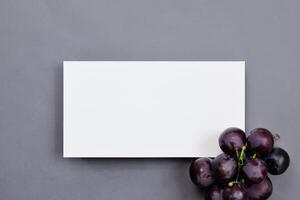 White Paper Mockup Enhanced by the Juicy Allure of Fresh Grapes, Crafting a Visual Symphony of Culinary Elegance and Wholesome Imagery, Where Graphic Design Flourishes in a Feast of Vibrant Creativity photo