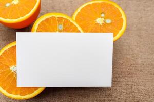 Generated imageWhite Paper Mockup Enlivened by the Zesty Aura of Fresh Oranges, Crafting a Visual Symphony of Culinary Opulence and Wholesome Design photo