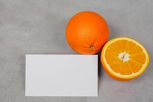White Paper Mockup Enlivened by the Zesty Aura of Fresh Oranges, Crafting a Visual Symphony of Culinary Opulence and Wholesome Design photo