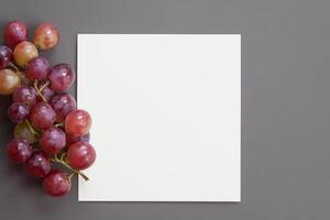 White Paper Mockup Enhanced by the Juicy Allure of Fresh Grapes, Crafting a Visual Symphony of Culinary Elegance and Wholesome Imagery, Where Graphic Design Flourishes in a Feast of Vibrant Creativity photo