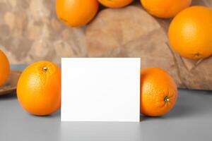 Generated imageWhite Paper Mockup Enlivened by the Zesty Aura of Fresh Oranges, Crafting a Visual Symphony of Culinary Opulence and Wholesome Design photo