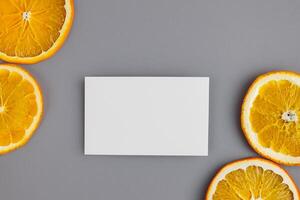 White Paper Mockup Enlivened by the Zesty Aura of Fresh Oranges, Crafting a Visual Symphony of Culinary Opulence and Wholesome Design photo