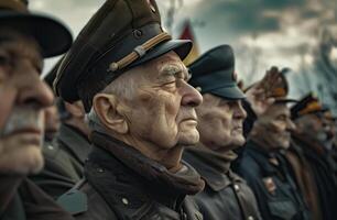 An American senior war veteran stands solemnly in a cemetery. . photo