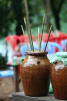 brewing rice wine in a tribal village in Cambodia photo