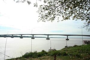 friendship bridge over the mekong river in cambodia photo