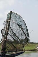 fishing net on a canoe photo