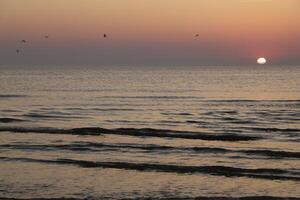 sunset at the beach photo