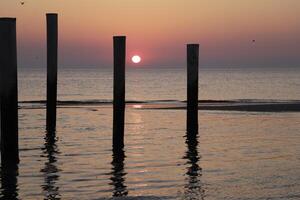 sunset in the pole village of Petten in the Netherlands photo