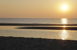 sunset at the beach photo